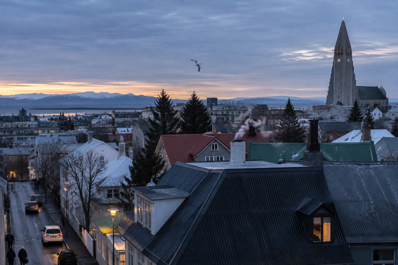 View across Reykjavik rooftops toward Hallgrímskirkja church on a clear day