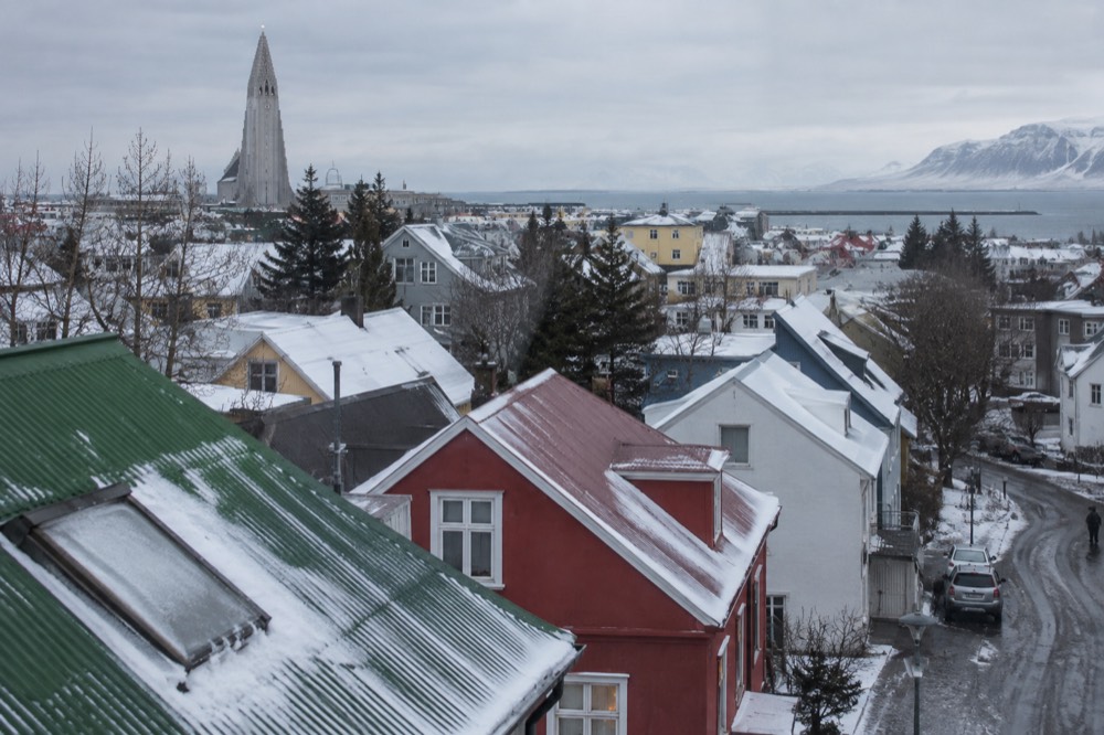 Colorful rooftops of central Reykjavik with the Hallgrimskirkja church tower rising behind them