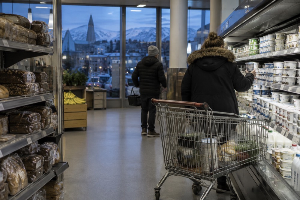 A supermarket aisle in Reykjavik with shelves of bread and dairy products