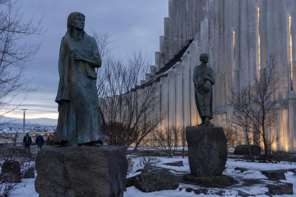 Bronze sculptures on stone plinths in the small garden behind Hallgrímskirkja