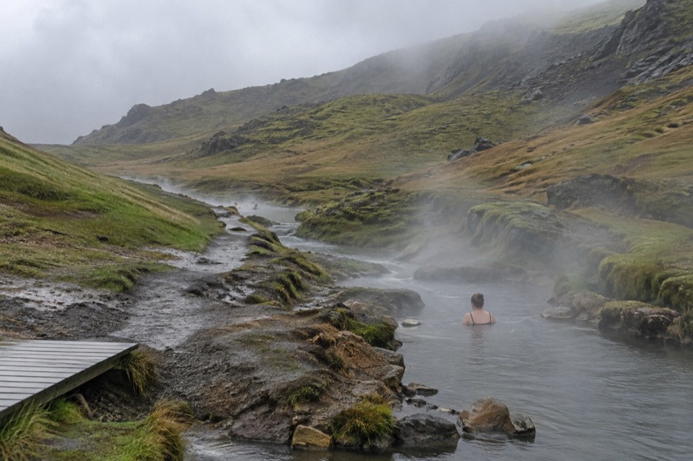 Steam rising from a river valley with a footpath alongside