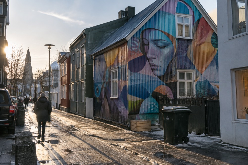 A large colourful mural painted on the gable wall of a building in Reykjavik
